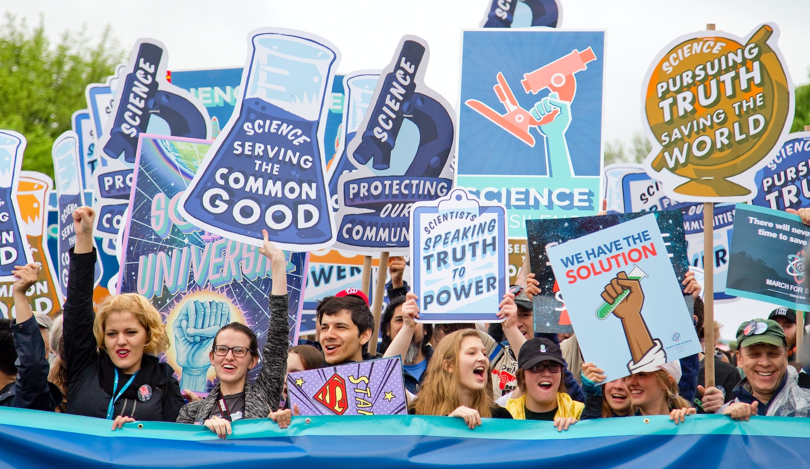 group of people with signages