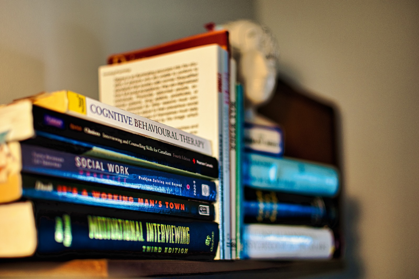 books on black wooden shelf